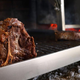 steak cooking over live coals